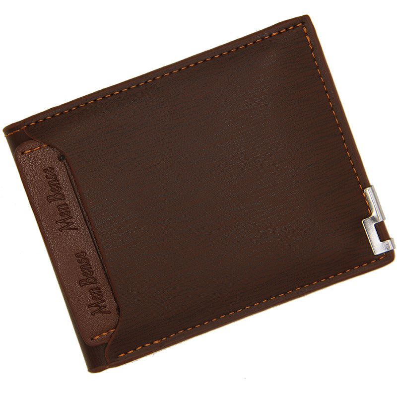 Brown menbense short PU wallet with bi-fold design and metal corner detail.
